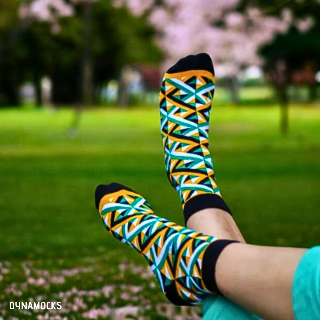 Colorful ankle-length socks crafted with an intricate design in a rainbow of colors including red, blue, yellow, green, and purple, ideal for brightening up any outfit with a burst of colors.